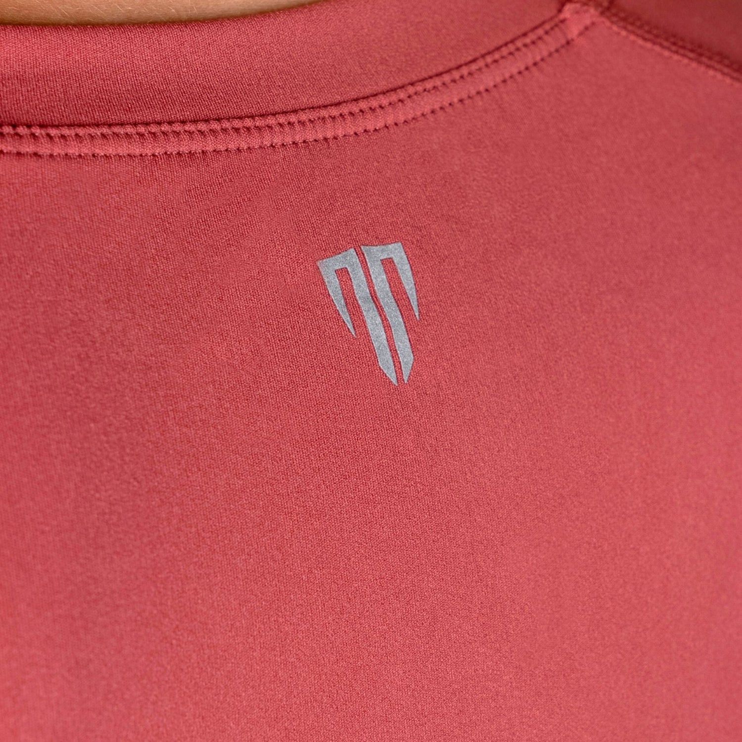 Red athletic shirt with a logo on the back